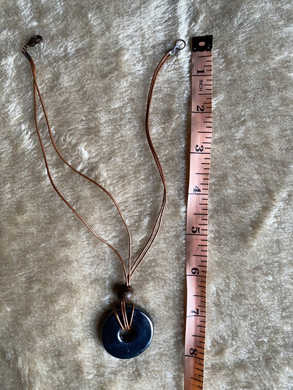 minimalist chunky black silver ceramic circle pendant 90s necklace handmade in the UK deadstock Unique vintage statement piece on brown