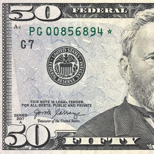 May include: A United States fifty-dollar bill featuring a portrait of Ulysses S. Grant. The bill has a green seal and serial numbers, with the text "The United States of America" and "Fifty Dollars".