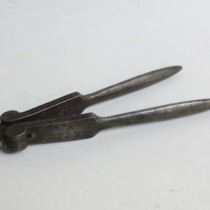 antique metallic nut and almond cracker