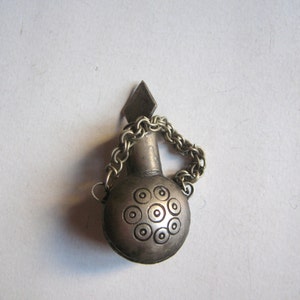 antique metallic perfume bottle
