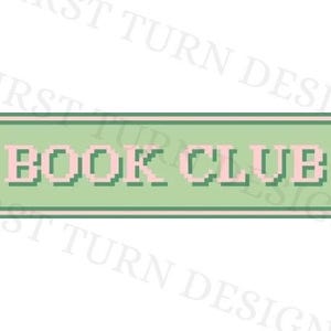 May include: A green rectangular sign with a white border and the text "BOOK CLUB" in pink letters.