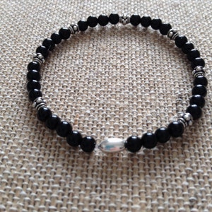 4mm Onyx and Sterling Silver granular Bali Beads stretch bracelet with a sterling silver tube bead