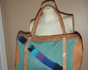 beautiful vintage boho mini duffle purse sort of aztec style fabric and leather aqua blues