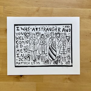 May include: Black and white illustration of five people standing in a row. Each person is wearing a different outfit and has a heart above their head. The text "I was a stranger and you welcomed me in - JC Matthew 25:35" is written at the bottom of the image. The artist's name, "Sarah Fuller", is written at the bottom right corner.