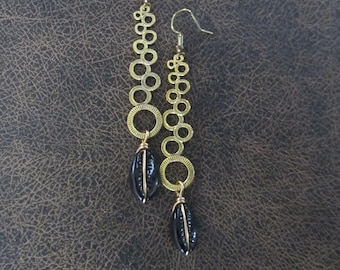 Long mid century modern gold and black cowrie shell earrings