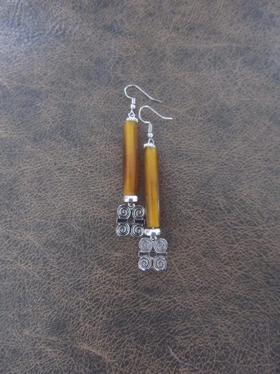 Silver adinkra symbol Afrocentric African earrings, orange bone primitive exotic earrings, strength dwennimmen