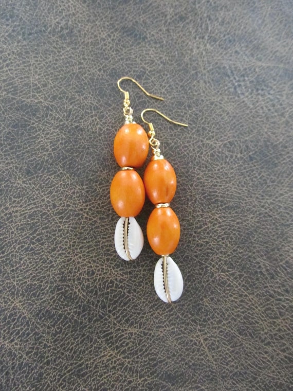 Orange wooden and cowrie shell earrings 22