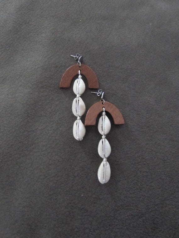 Long cowrie shell earrings, silver and wood
