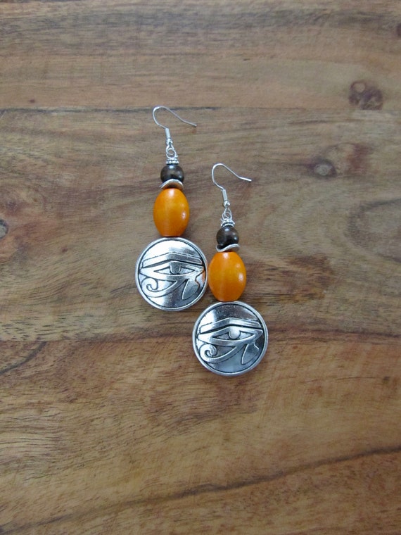 Egyptian African earrings, Afrocentric eye of Ra earrings, mythology, orange