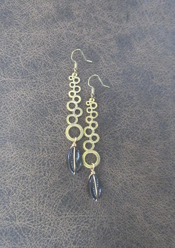Long mid century modern gold and black cowrie shell earrings