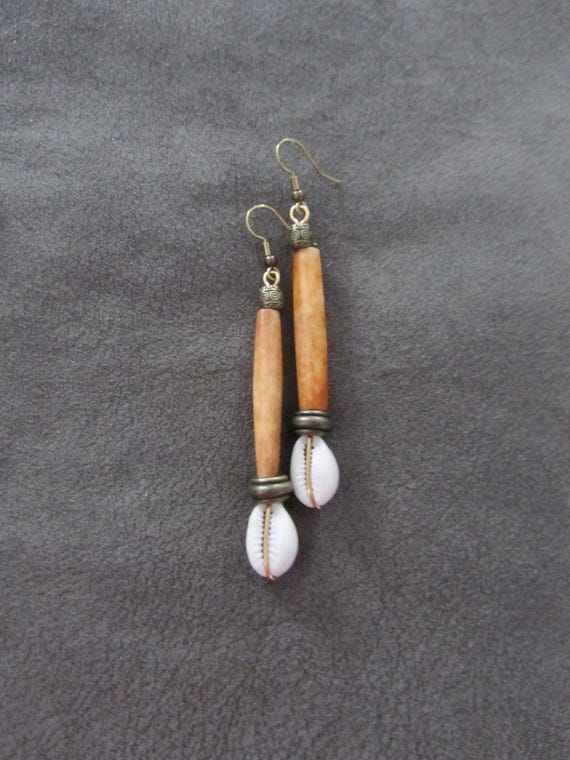 Long orange horn and cowrie shell earrings