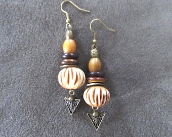 Carved bone and bronze ethnic earrings