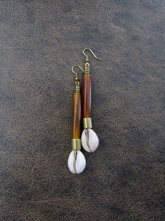 Long orange horn and cowrie shell earrings