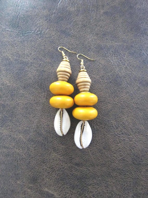 Bold chunky cowrie shell and yellow wooden earrings
