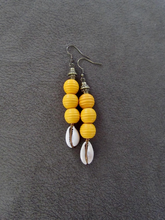 Wooden and cowrie shell earrings, yellow