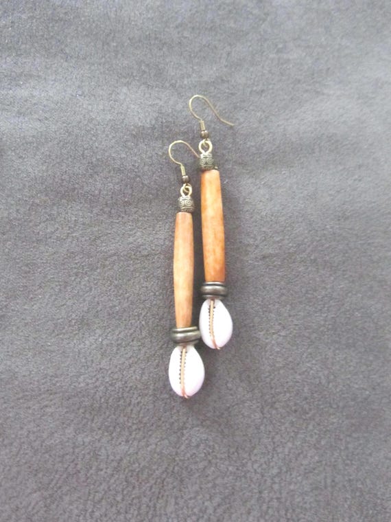Long orange horn and cowrie shell earrings