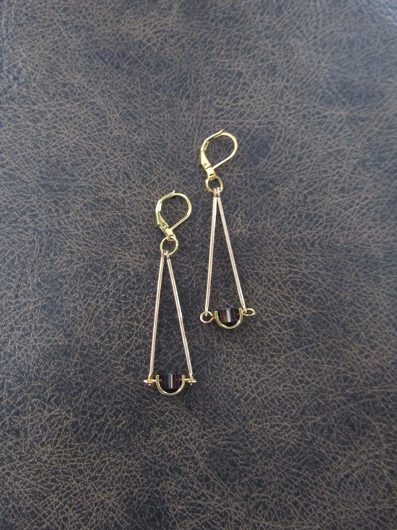 Gold pendulum earrings, purple hematite