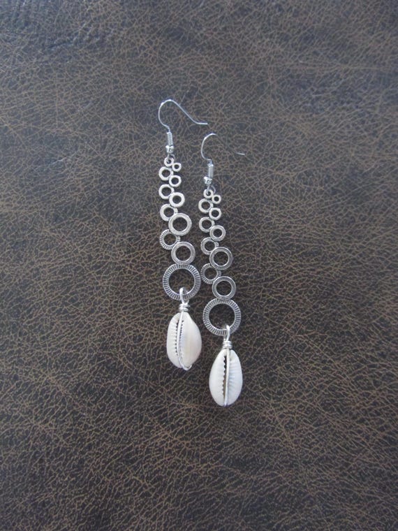 Long cowrie shell earrings, unique modern dangle earrings, Afrocentric earrings, African earrings, statement bold earrings, hammered silver