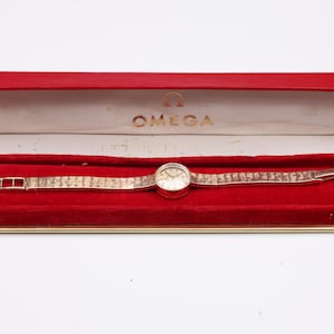 Relógio mecânico vintage OMEGA da década de 1950, caixa e pulseira em ouro amarelo maciço 14K