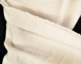 Tela de algodón tailandesa tejida con motivos geométricos, material de tapicería color beige.