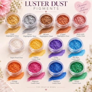 May include: A collection of thirteen small clear jars containing Luster Dust Pigments in various colors including gold, silver, bronze, copper, rose gold, super pearl, yellow, violet, sky blue, orange, magenta, sapphire, and green.