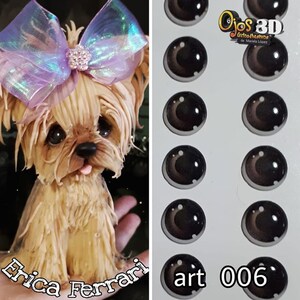 May include: A detailed sculpture of a Yorkshire Terrier dog with a light brown coat, a pink tongue, and a large, iridescent bow. Next to it are several pairs of glossy, dark brown, 3D doll eyes. The text "art 006" is visible.