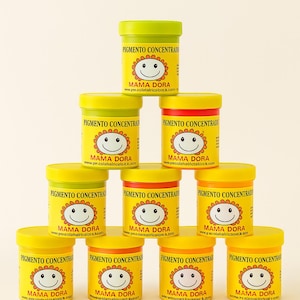 May include: A white ceramic mug with a black handle and the text "But First, Coffee" in a handwritten style. The mug is on a white surface. The mug is approximately 10 cm tall.