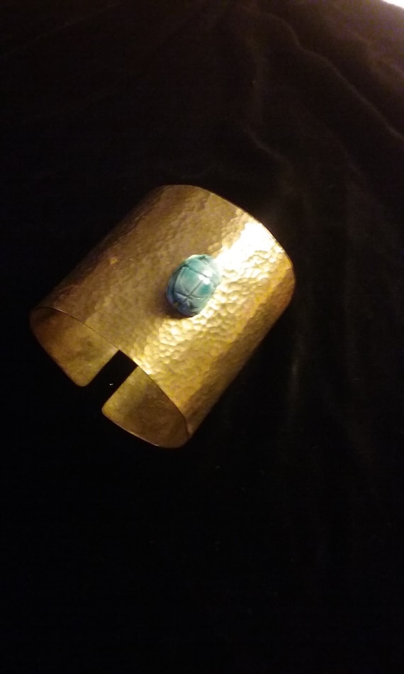 1970's  Brass Wrist Cuff with Hand Carved Blue Sca