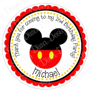 May include: Round, red and white favor sticker with a yellow polka dot border. The sticker features a black and white Mickey Mouse head with red and yellow Mickey Mouse ears. The text on the sticker reads "Thank you for coming to my 2nd Birthday Party!" and "Michael".