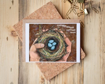 Greeting Card of mixed media collage of a hand holding a robin nest with four blue eggs in it, nature, birds, baby  -  Blank Inside