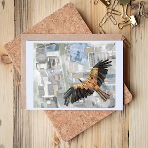 May include: A watercolor painting of a brown and black hawk flying over a city. The hawk has its wings spread wide and is looking down at the city below. The city is depicted in a stylized way, with buildings and streets represented by abstract shapes and lines.