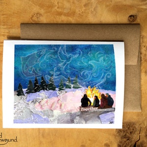 Carte de voeux d'amis réunis autour d'un feu de joie dans la neige - Aurora Borealis - Noël - Solstice d'hiver - Blanc à l'intérieur