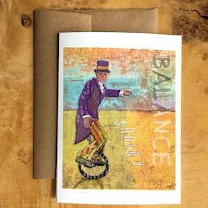 Carte de voeux représentant un collage en papier d'une personne conduisant un monocycle avec le mot « Balance » et une citation de Rumi - inspirante - vierge à l'intérieur