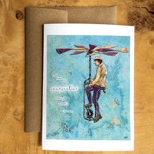 Carte de voeux représentant un collage en papier d'une personne conduisant une machine volante avec une citation imaginaire de John Muir - Inspirante - Vierge à l'intérieur