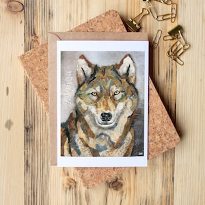 Carte de voeux avec collage technique mixte d'un loup avec une citation inspirante disant « Toutes les grandes voix ne sont pas humaines » - Blank Inside