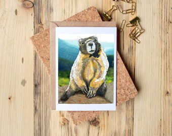 Greeting Card of mixed media collage of a marmot in the mountains, with words about marmots, fierce, strong, family first  -  Blank Inside