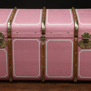 Pink curved steamer trunk