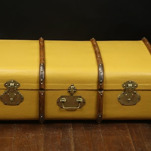 Yellow curved cabin trunk