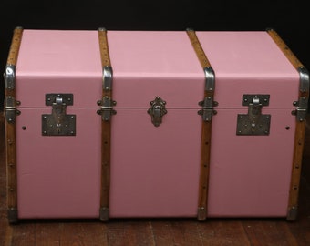 Pink curved steamer trunk