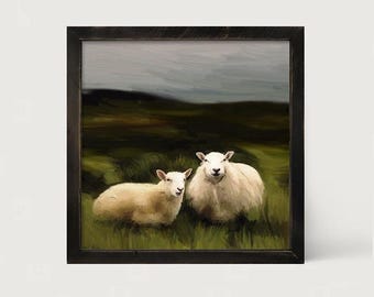 May include: A square framed wall art piece featuring an oil painting of two white sheep resting in a green grassy field under a dark, overcast sky. The sheep have thick, textured wool and are positioned in the center of the landscape scene.