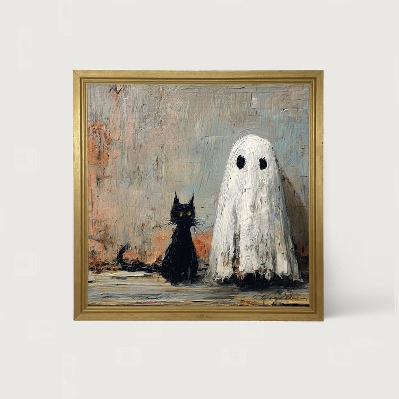 May include: A framed painting depicts a black cat and a ghost. The cat sits to the left, facing forward, with a long tail. The ghost is draped in a white sheet with two black eye holes. The background is a textured blend of gray, pink, and beige.