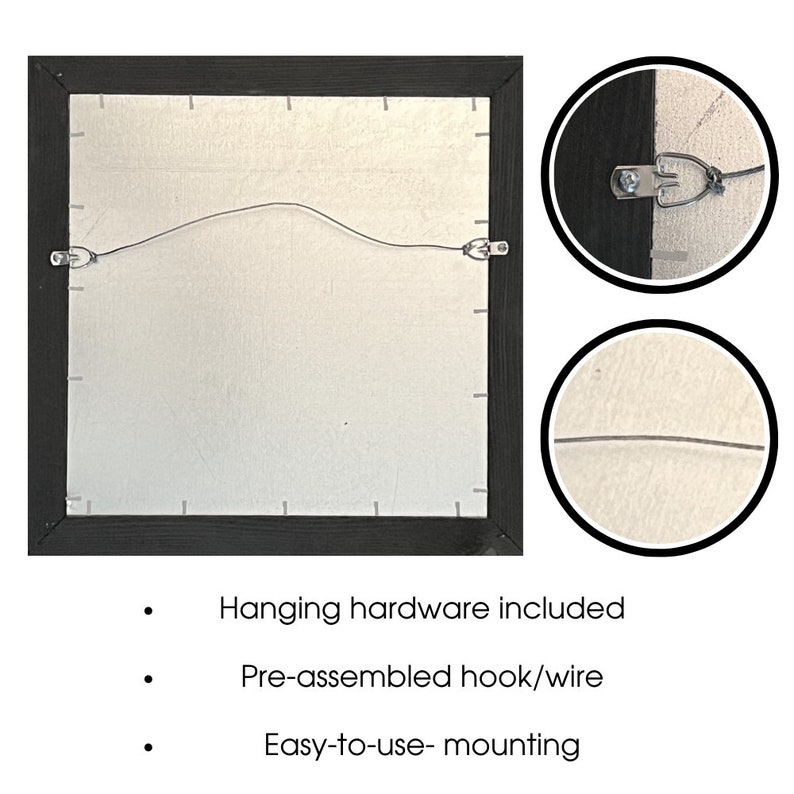 May include: Back of a framed artwork with a black frame, silver backing, and pre-installed hanging hardware. The image shows a wire and hooks for easy wall mounting. Text on the image states "Hanging hardware included", "Pre-assembled hook/wire", and "Easy-to-use- mounting".
