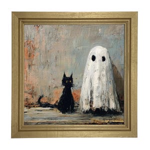 May include: A framed painting depicts a black cat and a white ghost. The cat has yellow eyes and is sitting next to the ghost. The ghost has two black eyes. The background is a textured mix of gray, orange, and blue. The frame is gold.