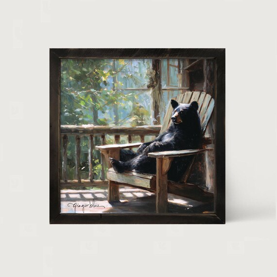 Bear Relaxing on Porch: [Framed Print] Wildlife artwork | Capture the whimsical charm of a bear enjoying a moment of pure relaxation.