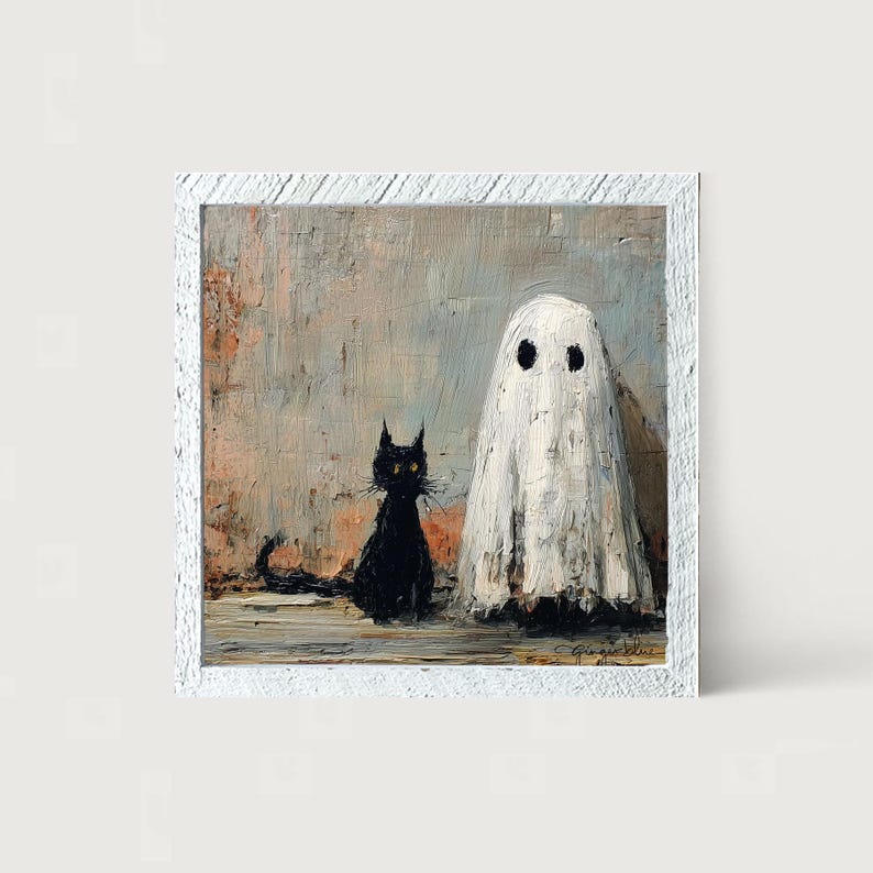 May include: A framed painting depicts a black cat and a white ghost. The cat has yellow eyes and is sitting. The ghost has two black eyes. The background is a textured mix of gray, beige, and peach.