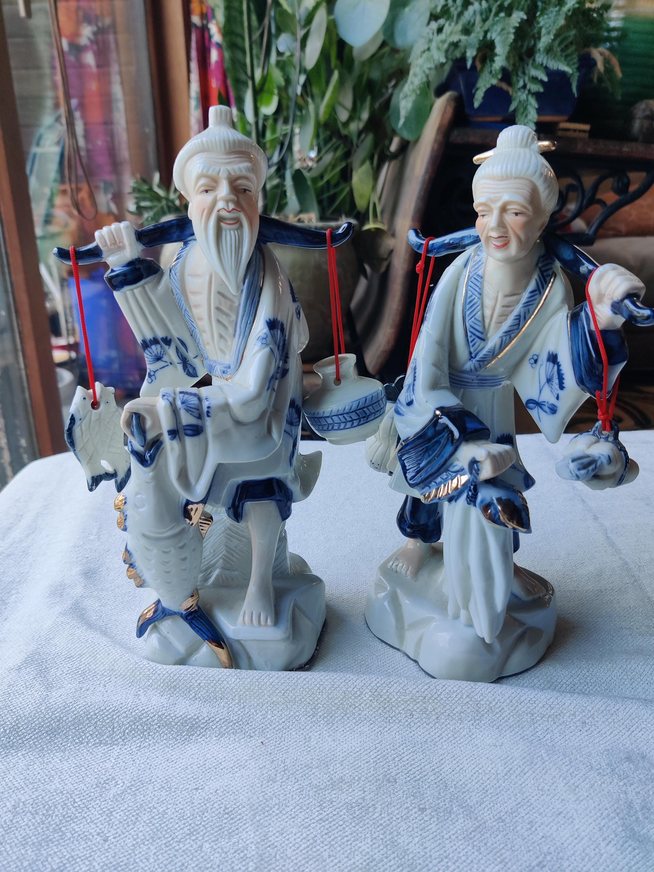 Vintage 1980 Porcelain Asian Fisherman Figurine in Cream and Tan - Unbranded display picture 1