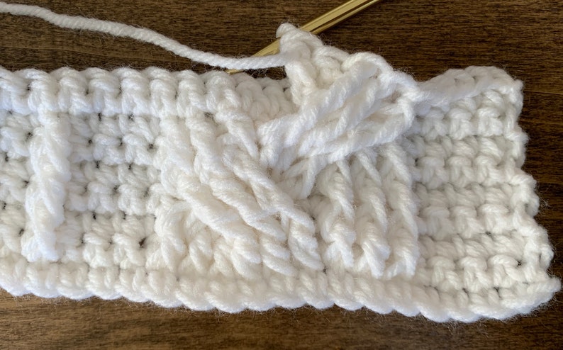 A Crochet Pillow Pattern White Braided Cables