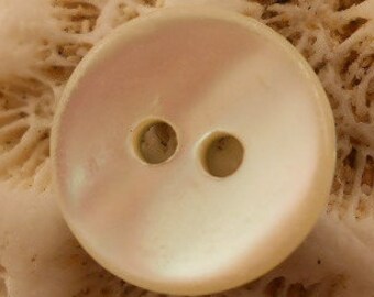 BUTTON SETS:  Mother of pearl, shell buttons, white, 7/16 inch size. slightly concave.  Set of 24 buttons.