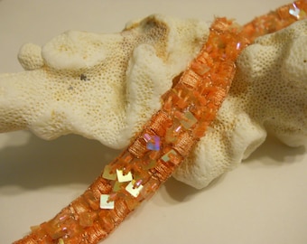 TRIM:  One yard of soft apricot orange trim with  square sequins and beads.