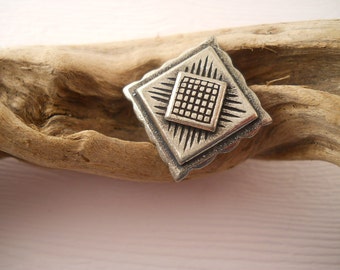 BUTTONS: Unusual square metal button, 3/4 inch size, detailed surface.